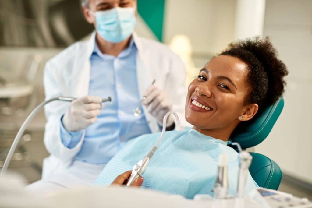 Happy,African,American,Woman,During,Dental,Appointment,At,Dentist's,Office